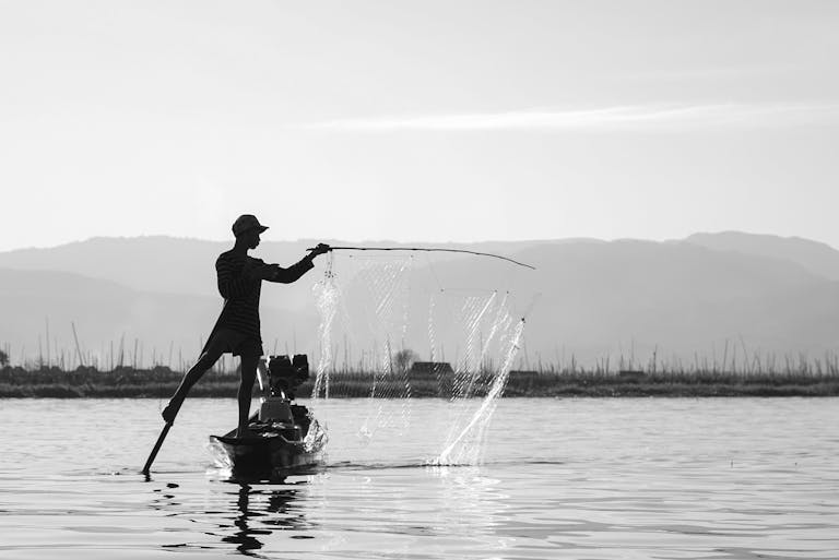 man fishing in sea water - (What is Chirp on a Fish Finder)